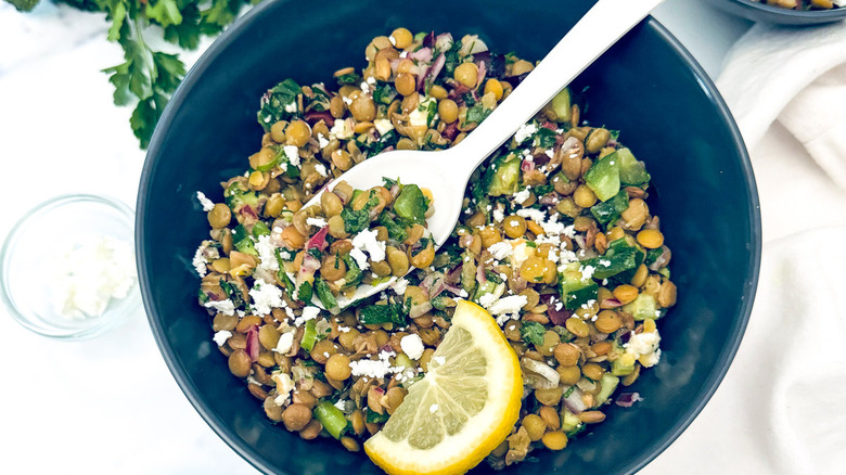 lentil salad in black bowl