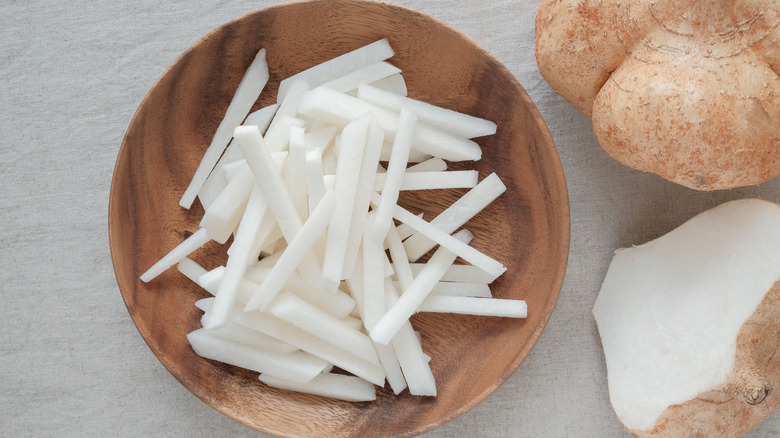 Wooden bowl of jicama sticks 