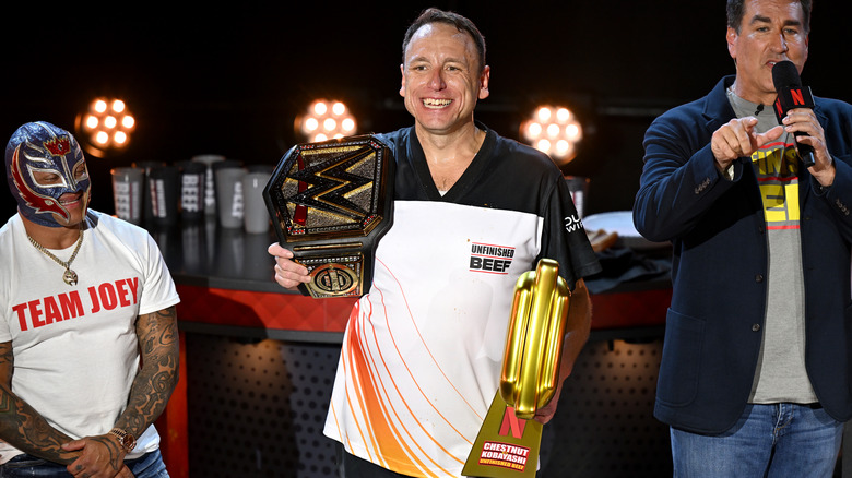 Joey Chestnut with championship belt