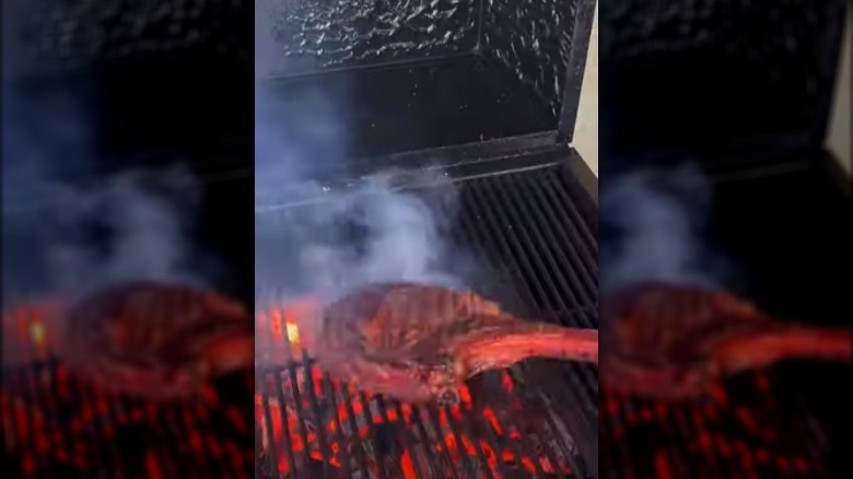 Steak on grill with flame