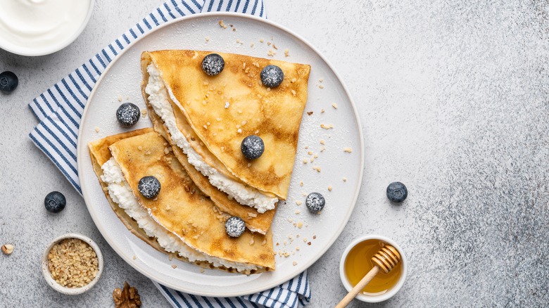 Crepes with blueberries and honey