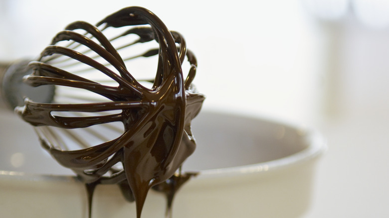 Chocolate covered whisk close up