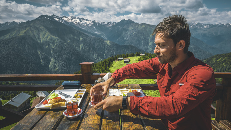 Turkish man eating Turkish breakfast