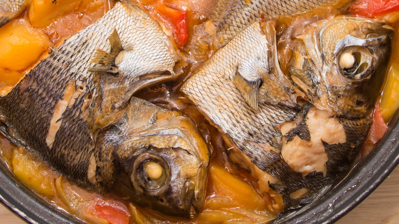 Fish simmering in red sauce 