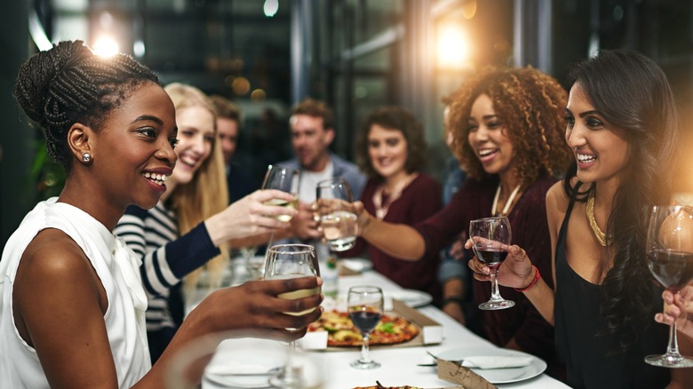 group of friends at a restaurant dinner table