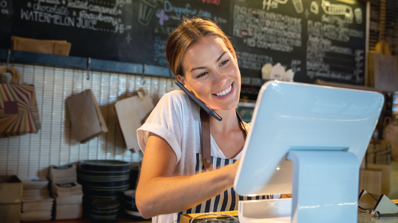 woman at restaurant on phone