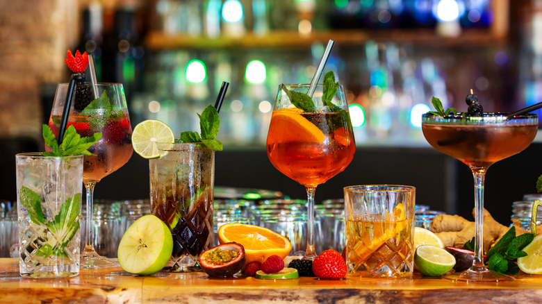 cocktails lined up across bar