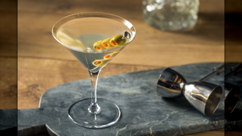 dirty martini by olives and jigger