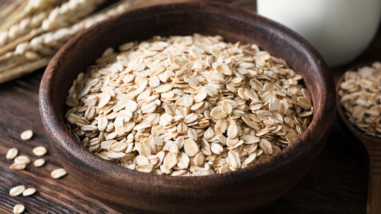 A wooden bowl of oats