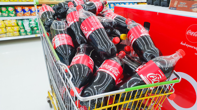 Coca-Cola bottles in cart