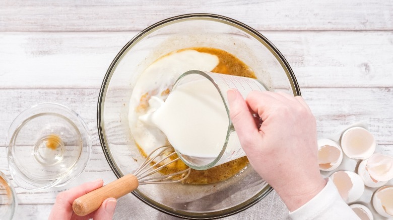 Person making French toast custard