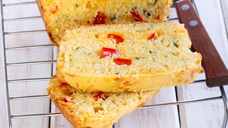 Cast iron skillet with cornbread and red peppers