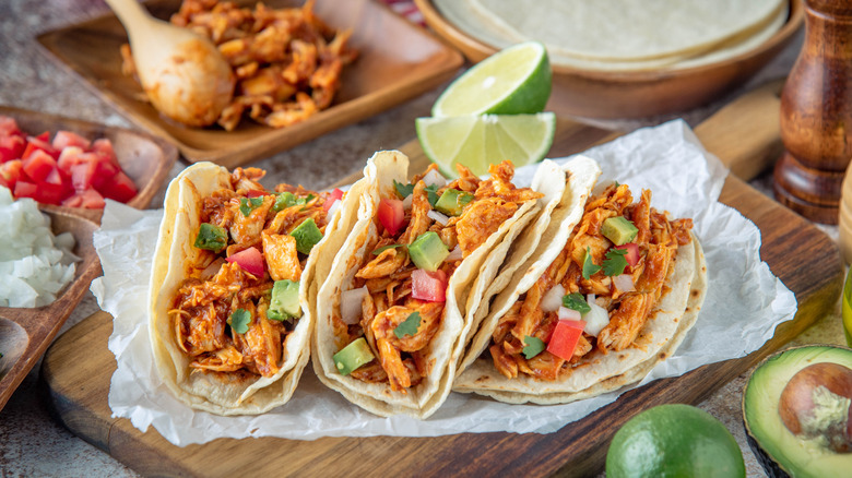 Shredded chicken tacos and their ingredients