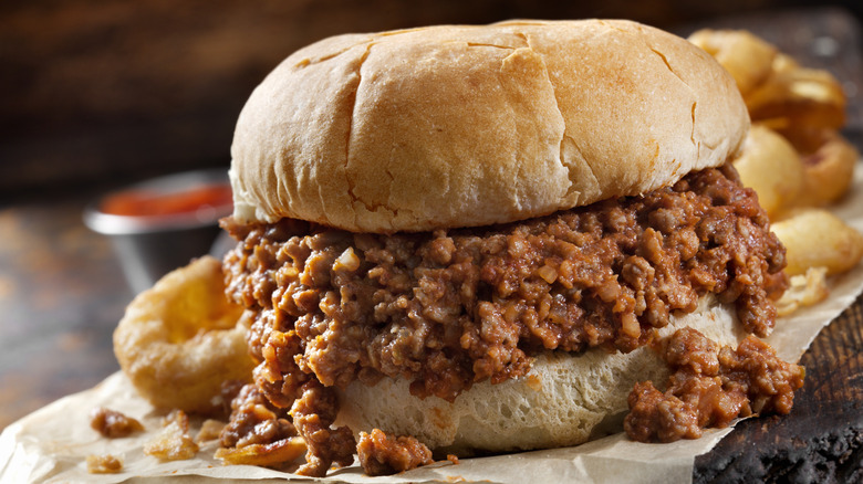 Sloppy Joe sandwich with onion rings