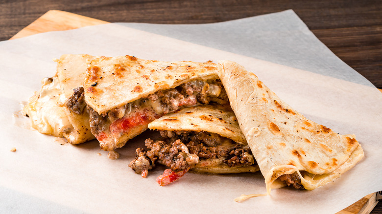 Close up of a sliced ground beef quesadilla