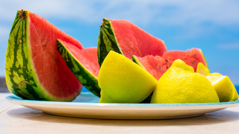 lemons and watermelon on plate