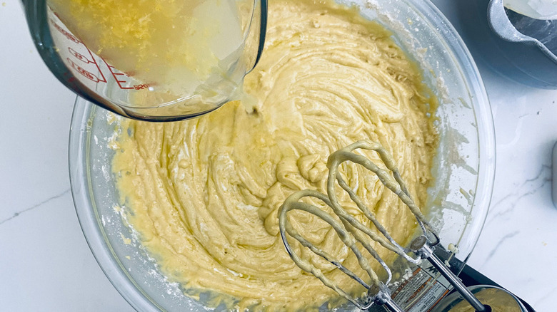 lemon juice pouring into batter