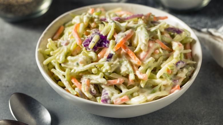 Coleslaw in bowl near spoon