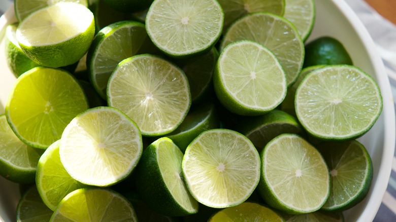 halved limes in bowl