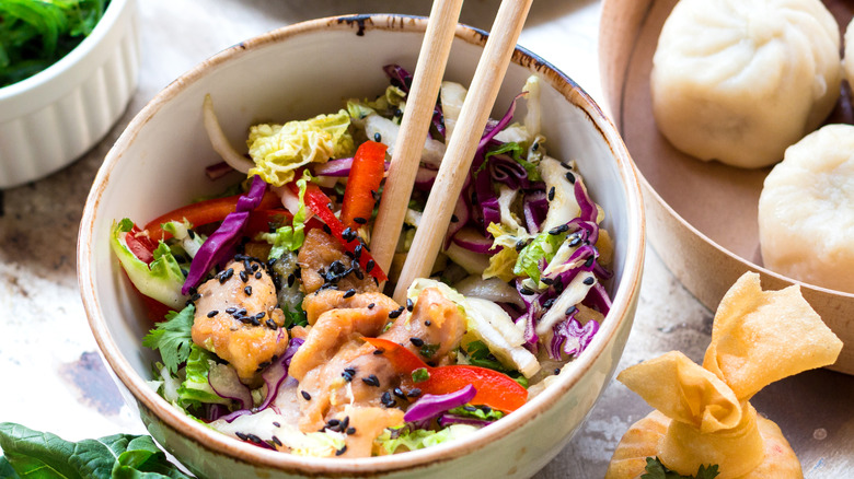 Bowl of salad with dumplings