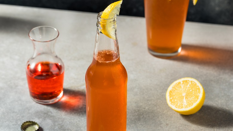 Spaghett with lemon wedge and aperol carafe