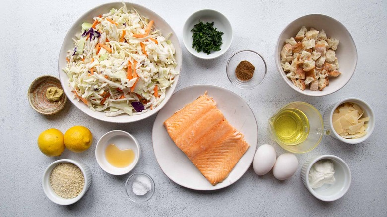 raw salmon, coleslaw mix, eggs, croutons, and assorted other ingredients