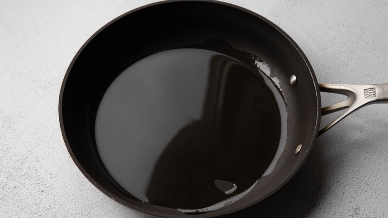 Oil in a black frying pan