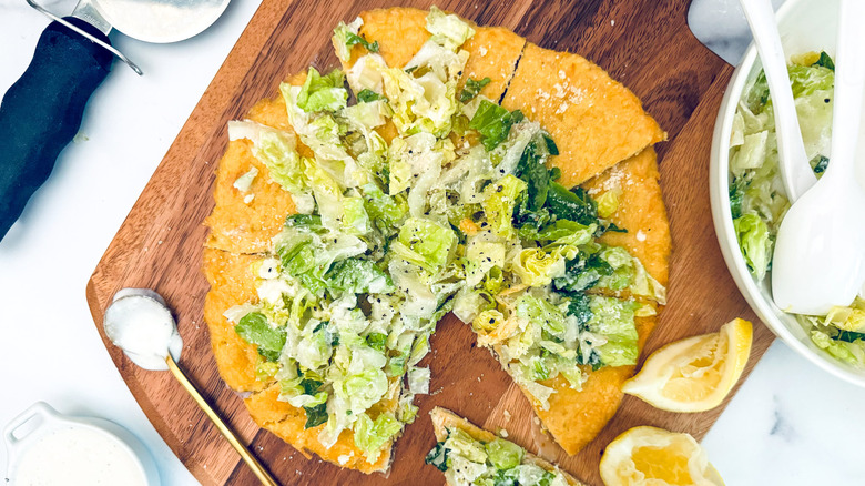 Caesar pizza with chicken crust