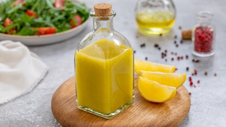 Bottle of vinaigrette with lemon