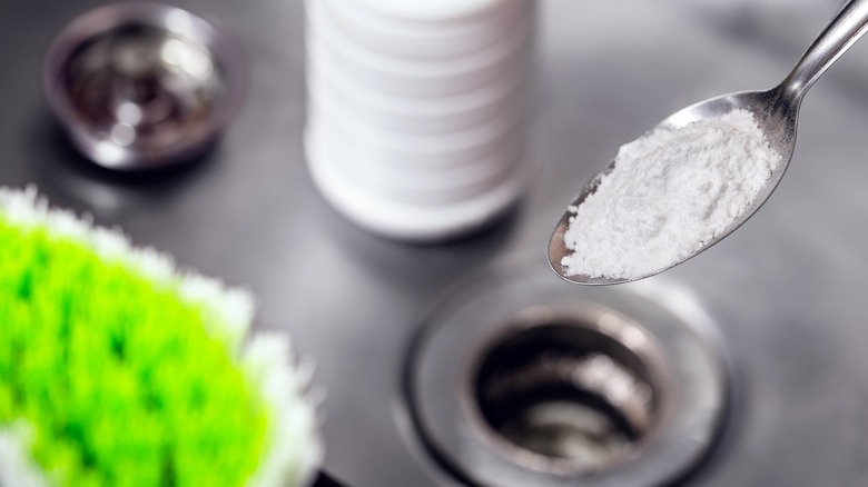 spoonful of baking soda over sink