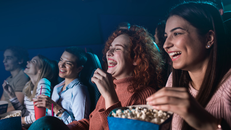 People enjoying a movie in a theater