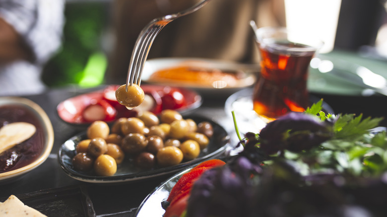 Plate of olives with fork 