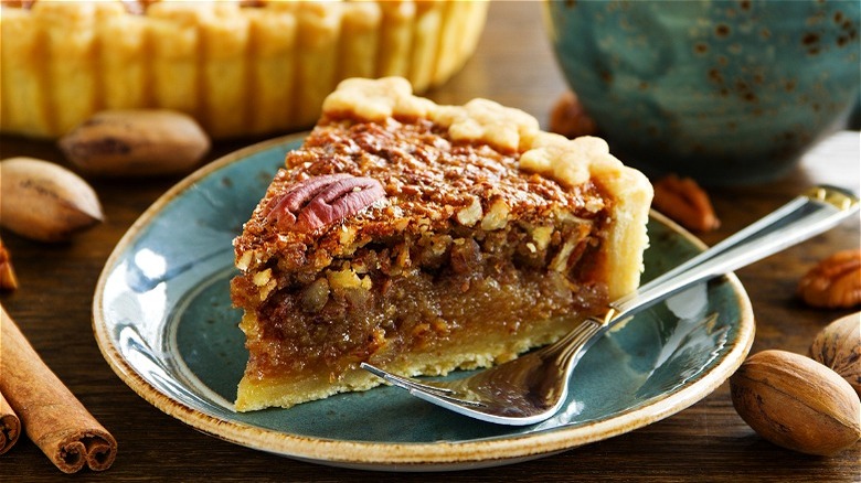 Slice of pecan pie with fork