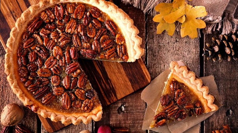 Pecan pie on wood cutting board