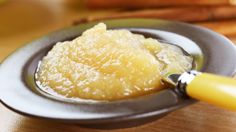 Bowl of applesauce with spoon in it