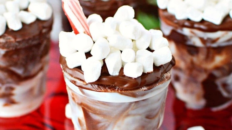 A plastic cup with chocolate and marshmallows