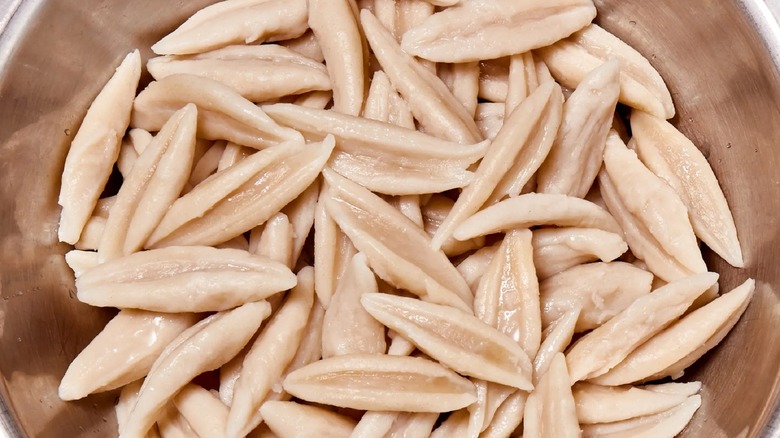 scissor-cut noodles in metal bowl 