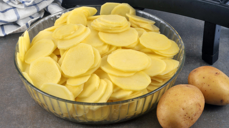 Bowl of sliced potatoes