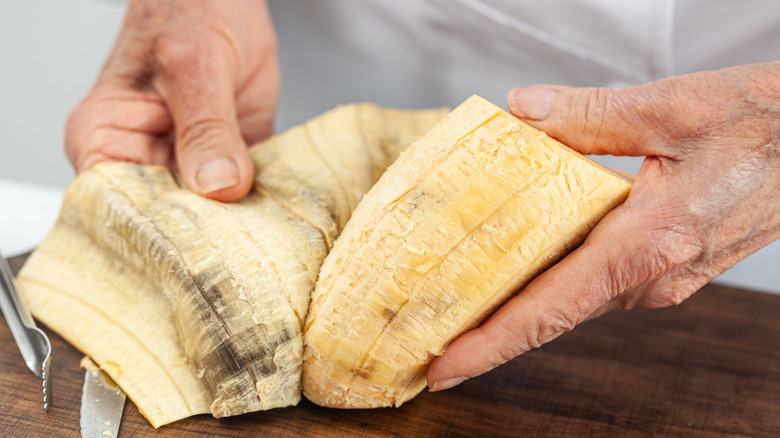 peeling a ripe plantain