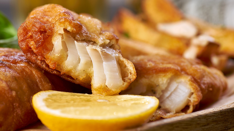 Fried fish with lemon wedge