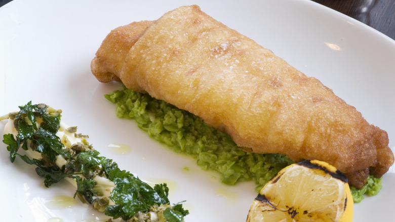 Fancy fried fish with charred lemon