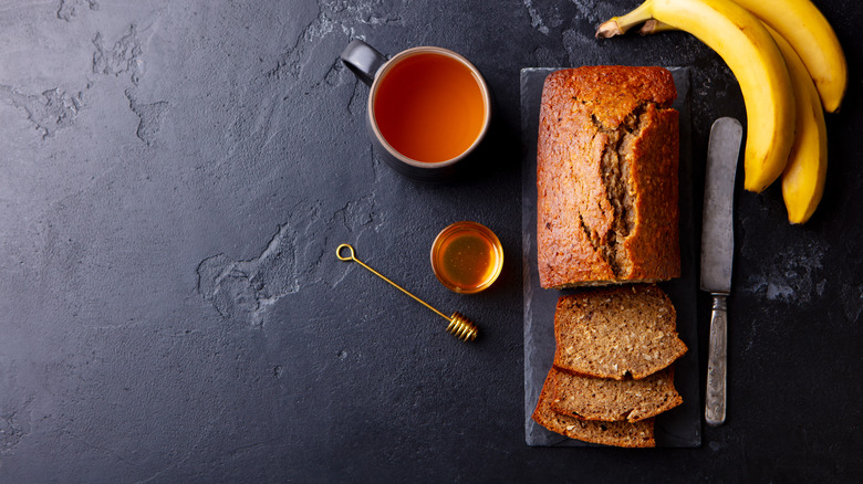 banana bread next to cup of tea