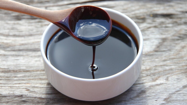 Molasses dripping off a spoon