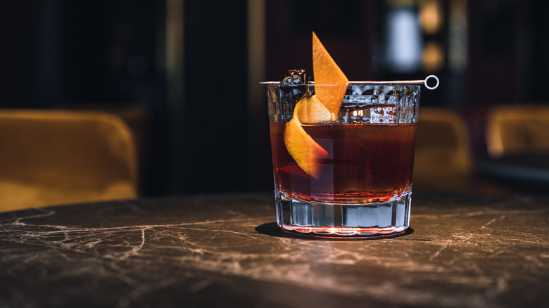 Old fashioned cocktail with orange