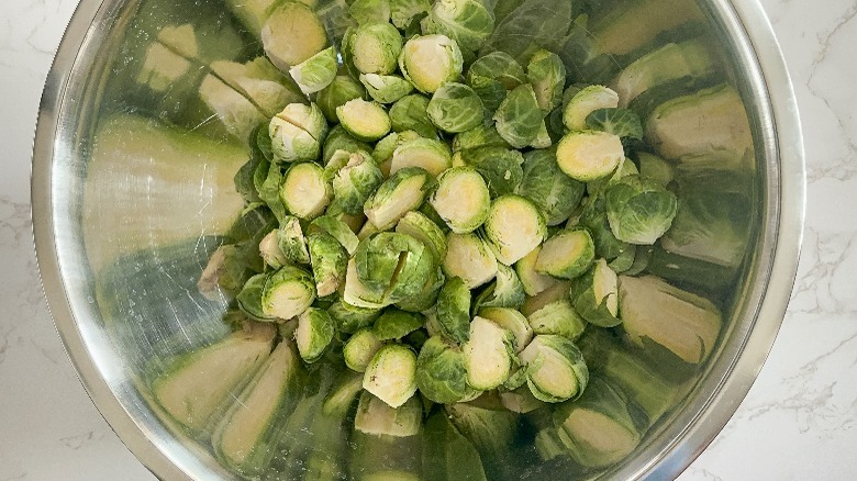 halved brussels sprouts in large bowl