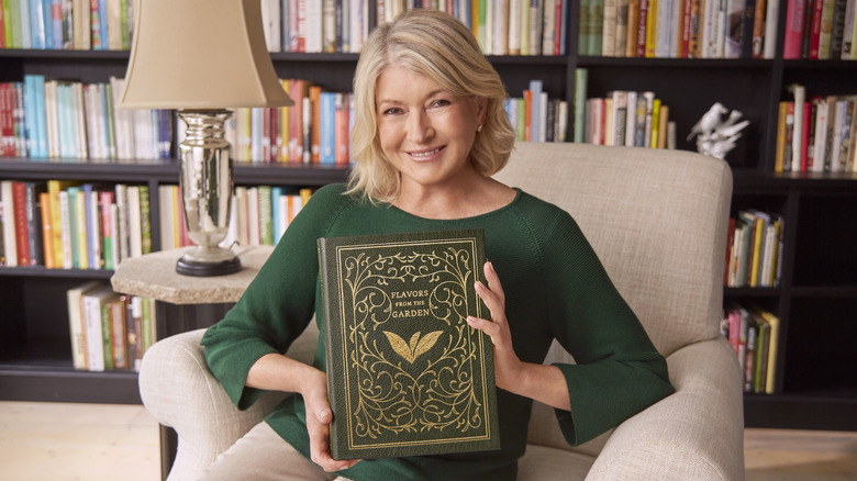 Martha Stewart holds garden book