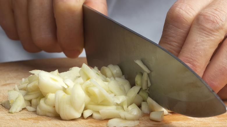 Cutting garlic with knife
