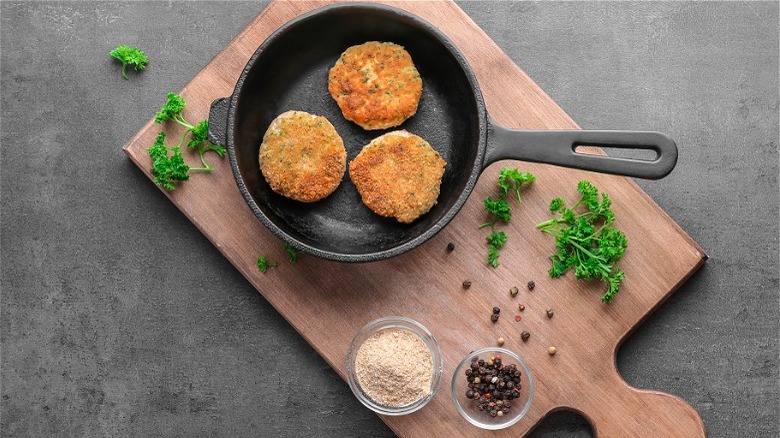 Fish patties in cast iron pan 