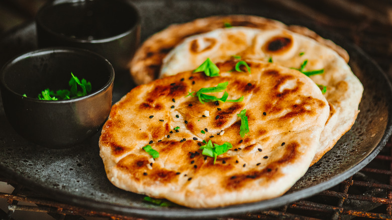 Three pieces of garlic naan