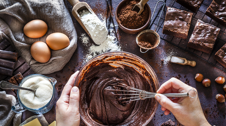 person making chocolate brownies